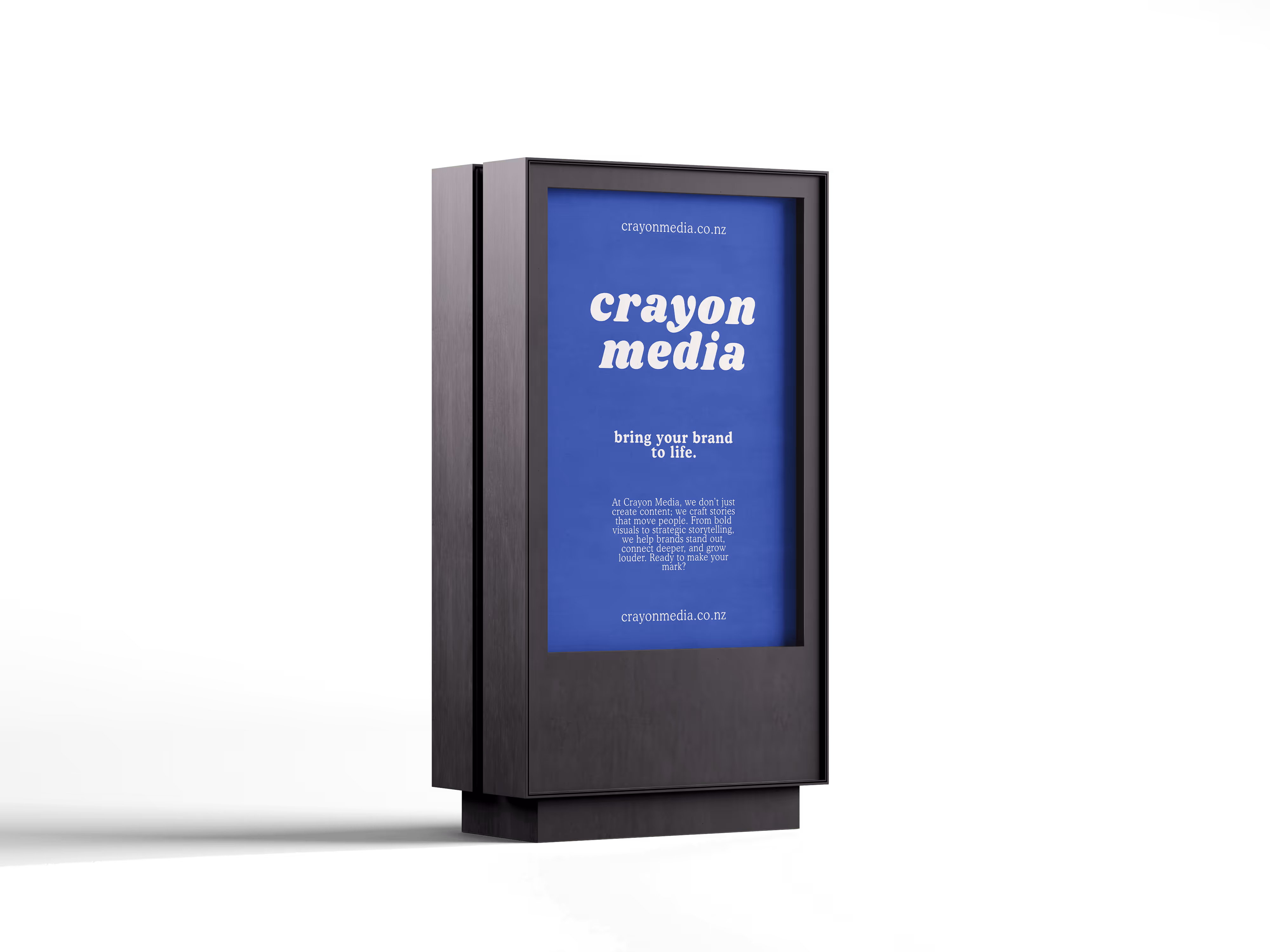 A black advertising display featuring a blue backdrop with white text that reads "crayon media" and the slogan "bring your brand to life." The display is freestanding and showcases the website at the bottom.